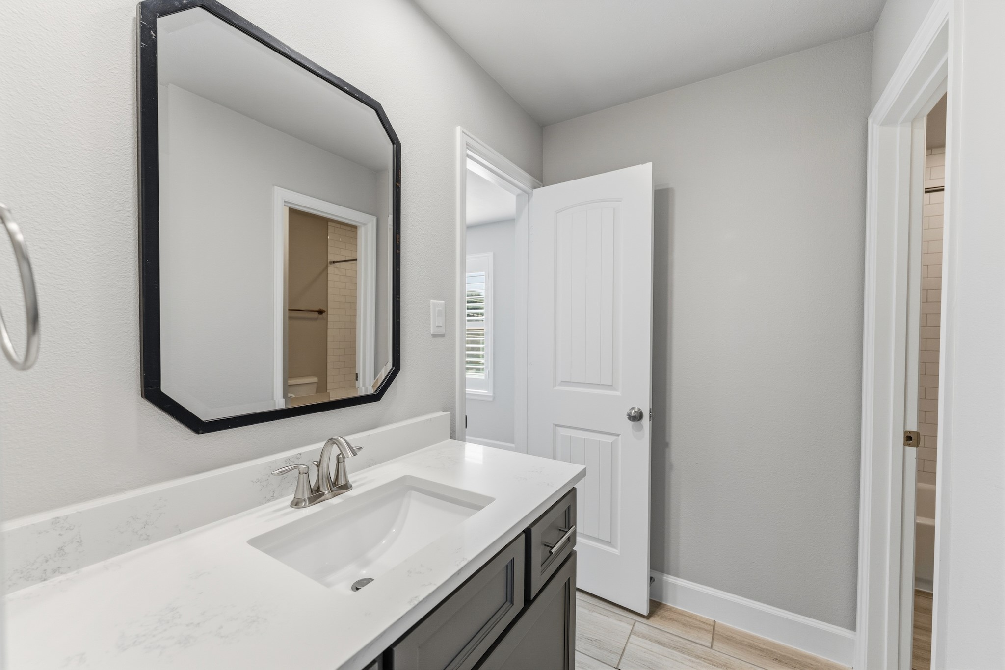 2607 Nicholson Street Houston, TX 77008 - Photo 26 of 29 a bathroom with a granite countertop sink and a mirror