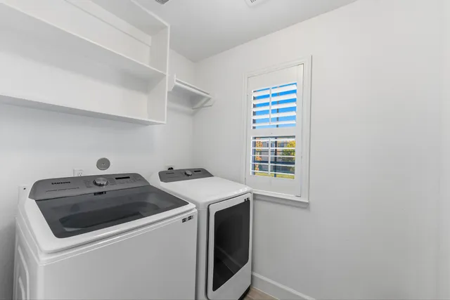 a utility room with dryer and washer