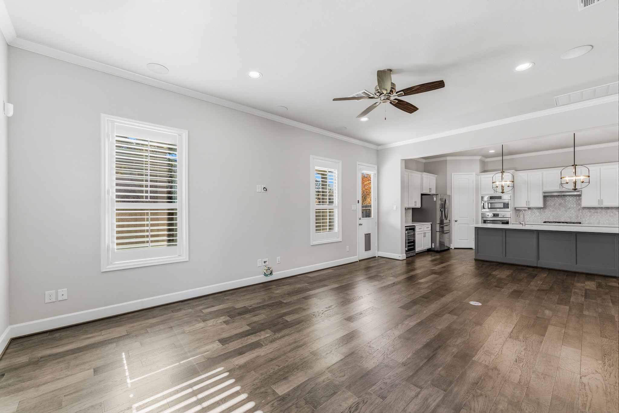 2607 Nicholson Street Houston, TX 77008 - Photo 4 of 29 a view of an empty room with window and wooden floor