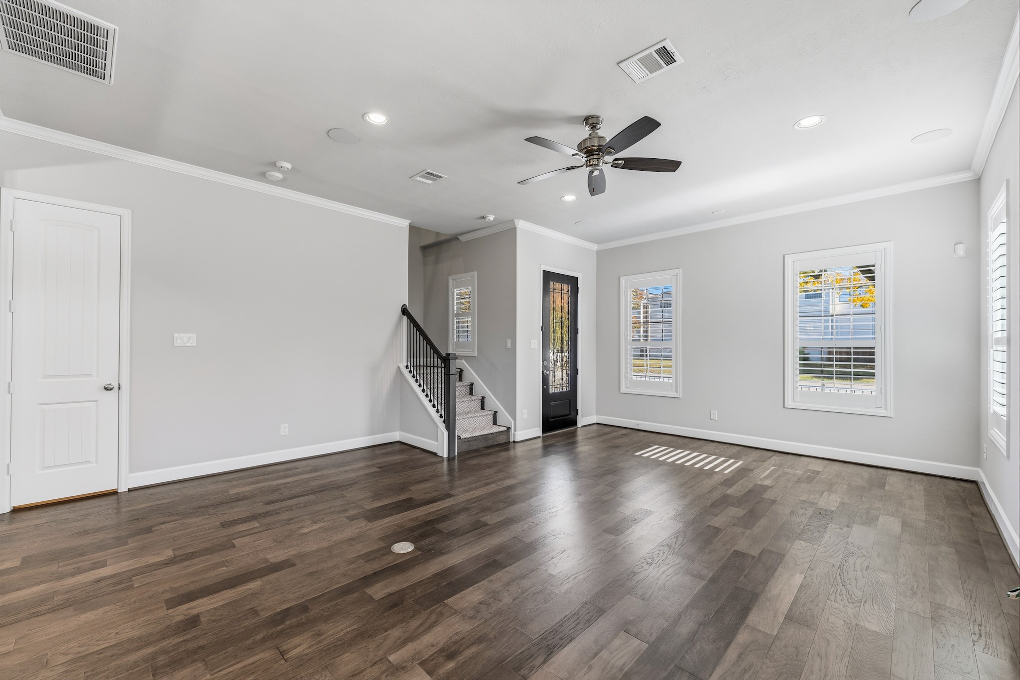 2607 Nicholson Street Houston, TX 77008 - Photo 5 of 29 a view of an empty room with wooden floor and a window