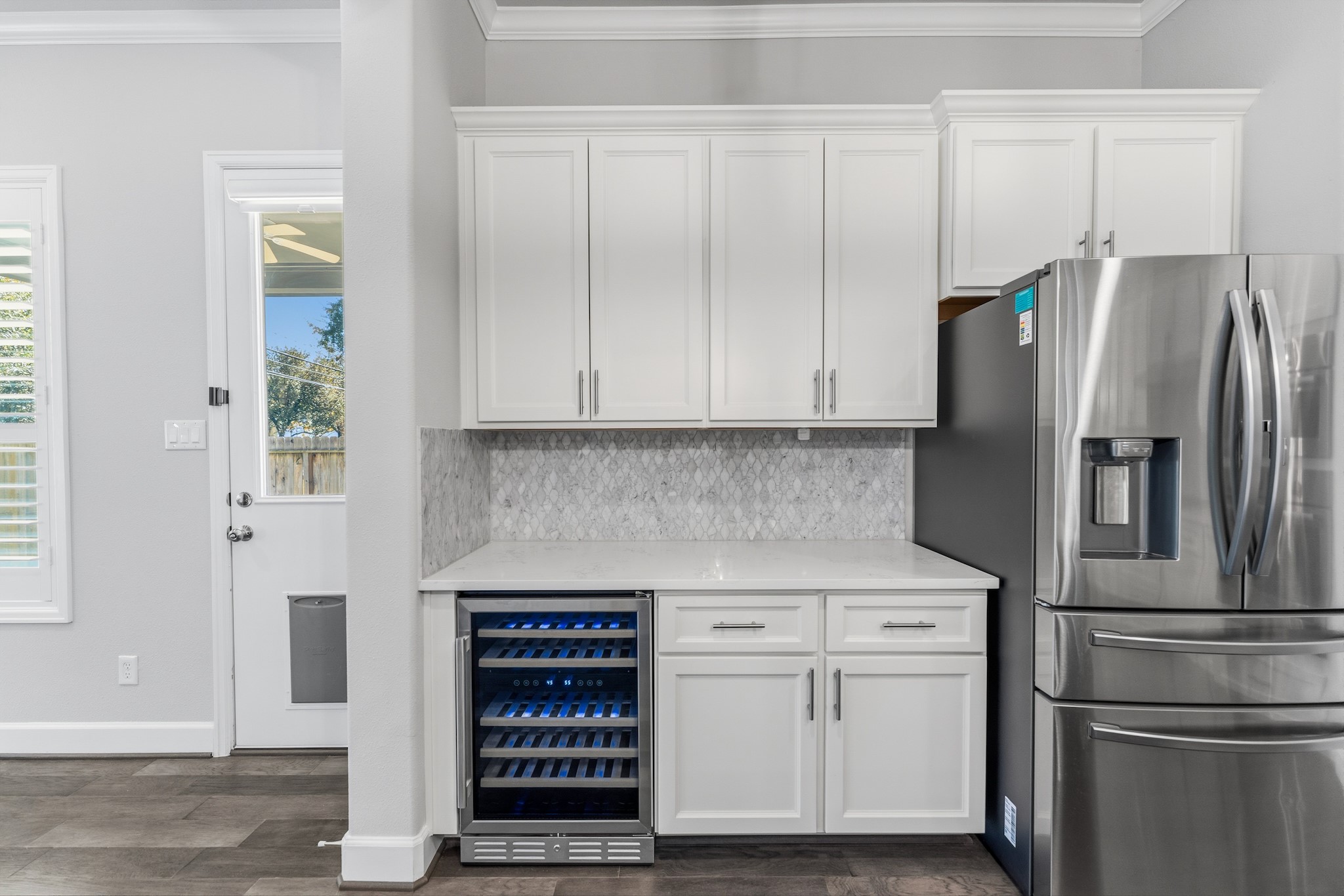 2607 Nicholson Street Houston, TX 77008 - Photo 9 of 29 a kitchen with stainless steel appliances white cabinets and a refrigerator