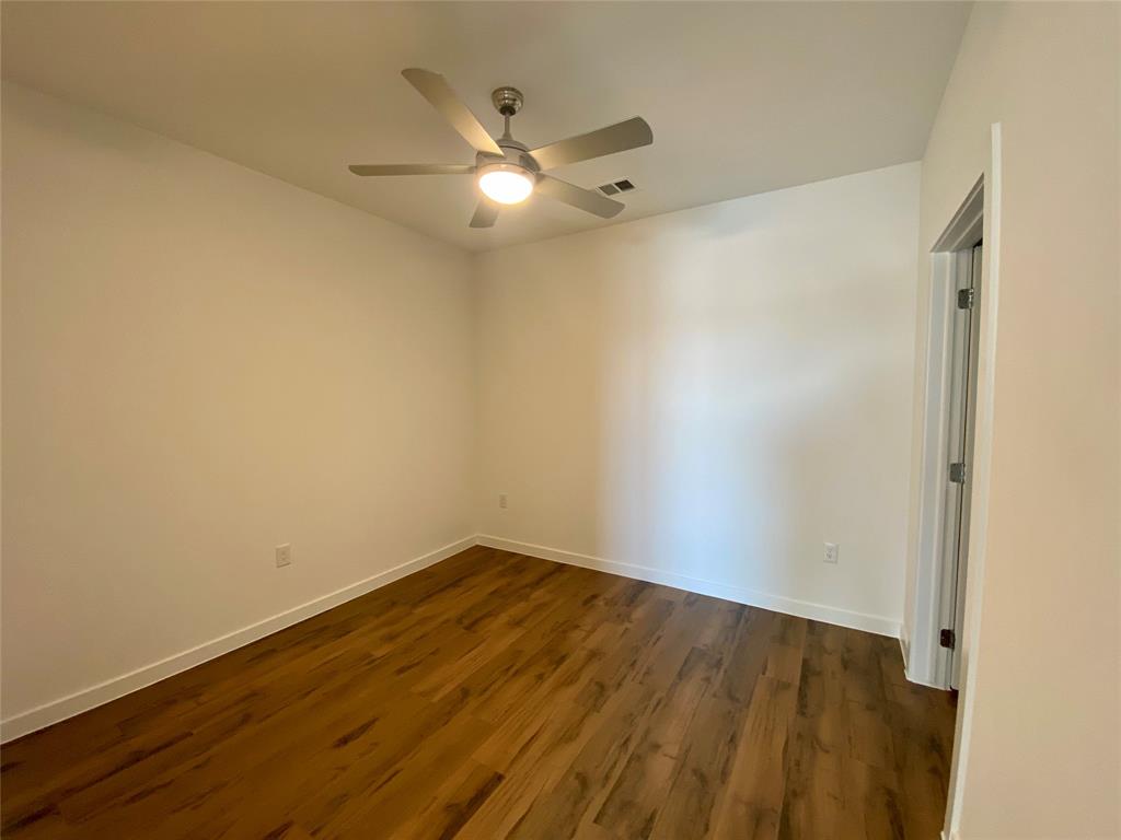 4801 Springdale Road, Unit 2408 Austin, TX 78723 - Photo 11 of 22 wooden floor in an empty room