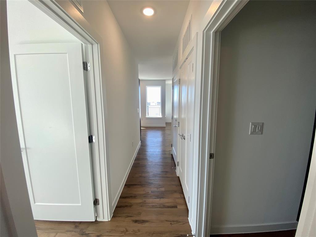 4801 Springdale Road, Unit 2408 Austin, TX 78723 - Photo 14 of 22 a view of a hallway with wooden floor