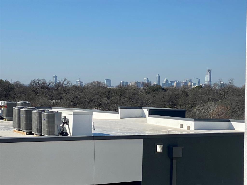 4801 Springdale Road, Unit 2408 Austin, TX 78723 - Photo 19 of 22 a view of a lake with a city