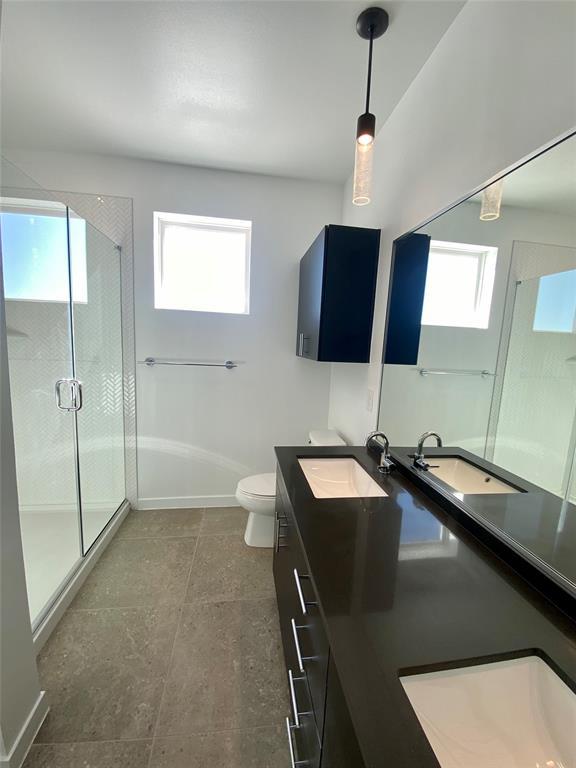 4801 Springdale Road, Unit 2408 Austin, TX 78723 - Photo 6 of 22 a kitchen with a sink a counter top space and stainless steel appliances