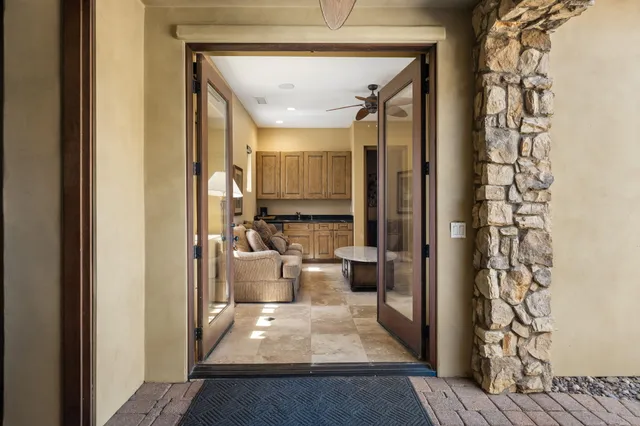 a view of a swimming pool with a garden and plants