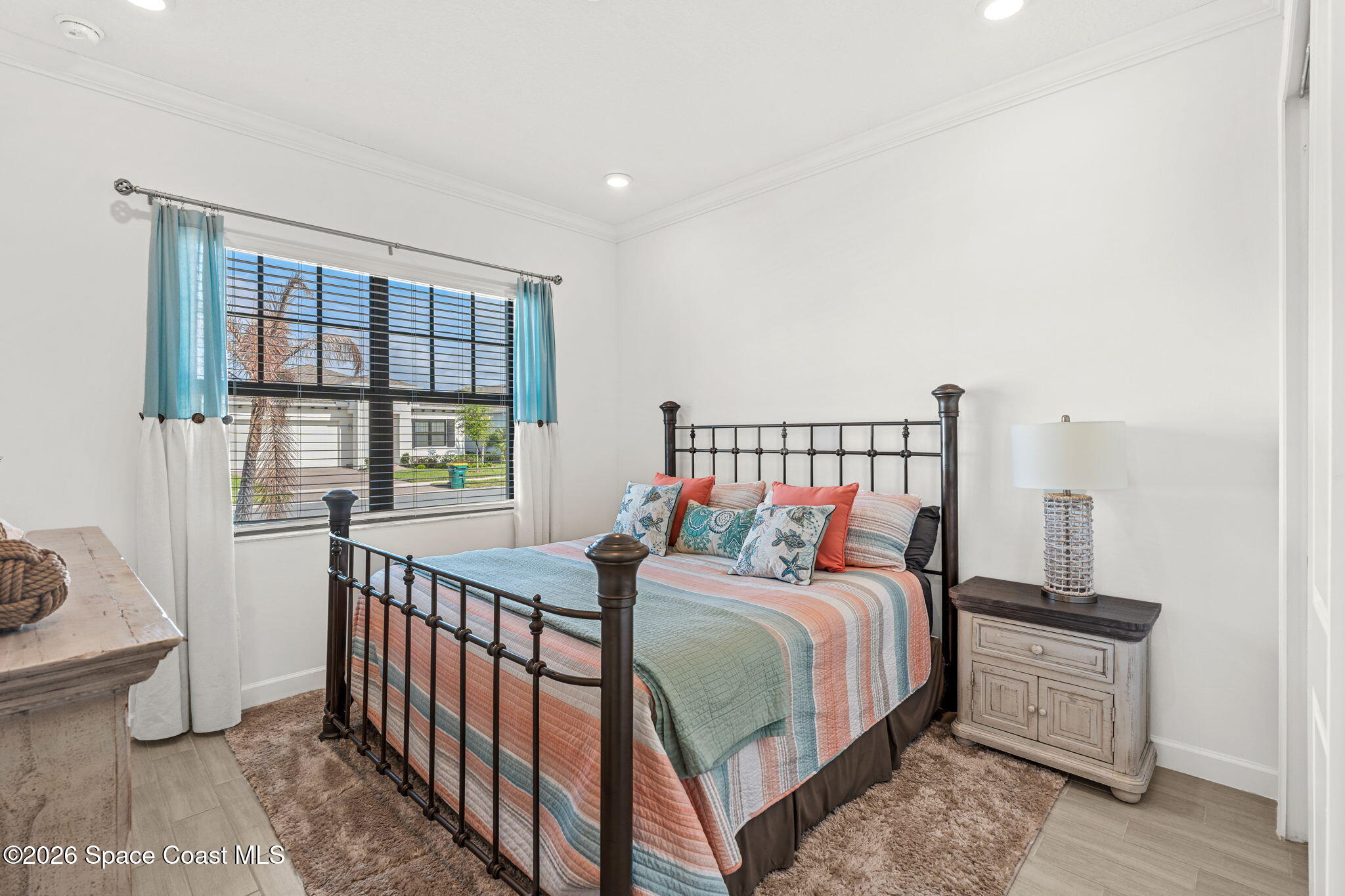 8904 Alister Drive Melbourne, FL 32940 - Photo 33 of 91 a bedroom with a bed and a window