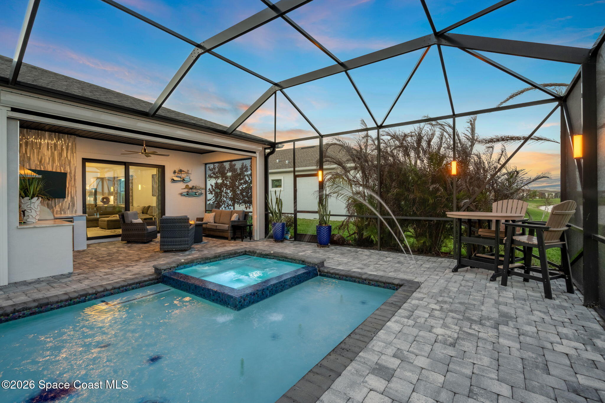 8904 Alister Drive Melbourne, FL 32940 - Photo 53 of 91 a view of a swimming pool with a patio