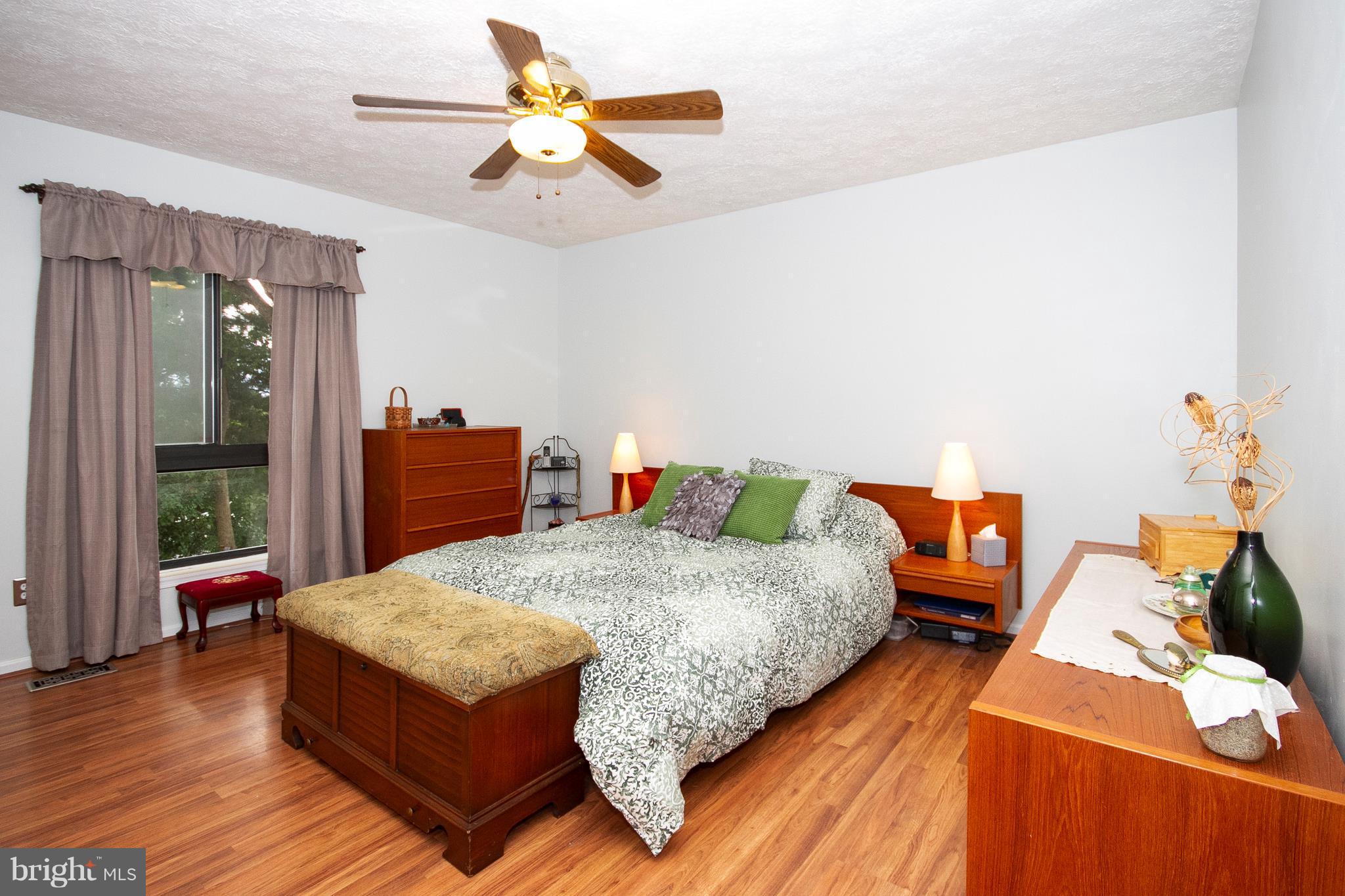 9513 Hallhurst Road Baltimore, MD 21236 - Photo 13 of 30 a bedroom with bed and window