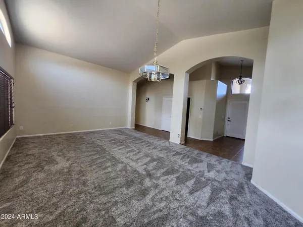 a view of a big room with closet and windows