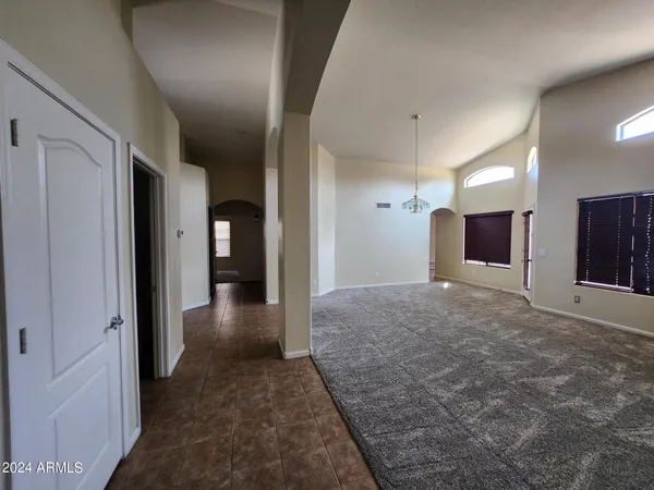 a view of a livingroom with an empty space and a fireplace