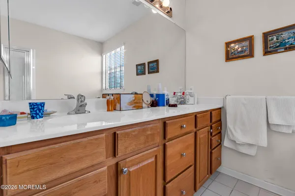 a kitchen with cabinets and window