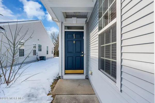 a lobby with furniture and window