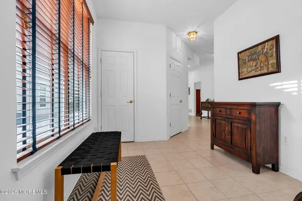 a view of a livingroom with furniture and a dining table