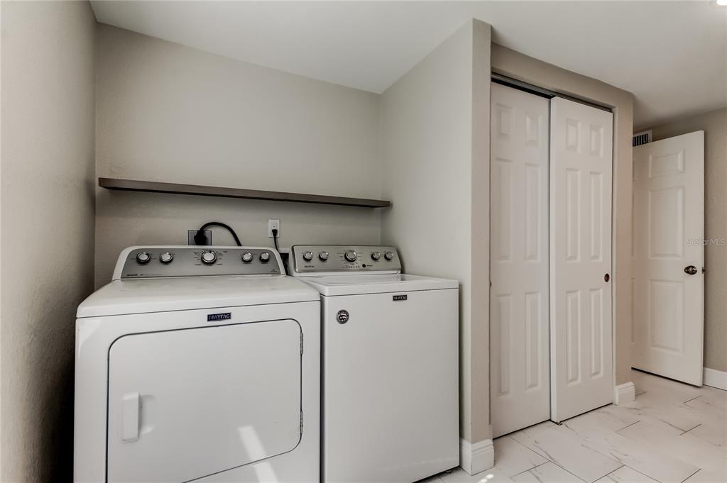 1353 Mary L Road Clearwater, FL 33755 - Photo 23 of 44 a utility room with dryer and washer