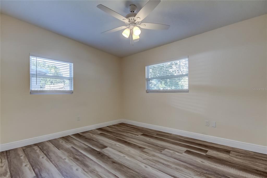 1353 Mary L Road Clearwater, FL 33755 - Photo 29 of 44 a view of a room with window and ceiling fan
