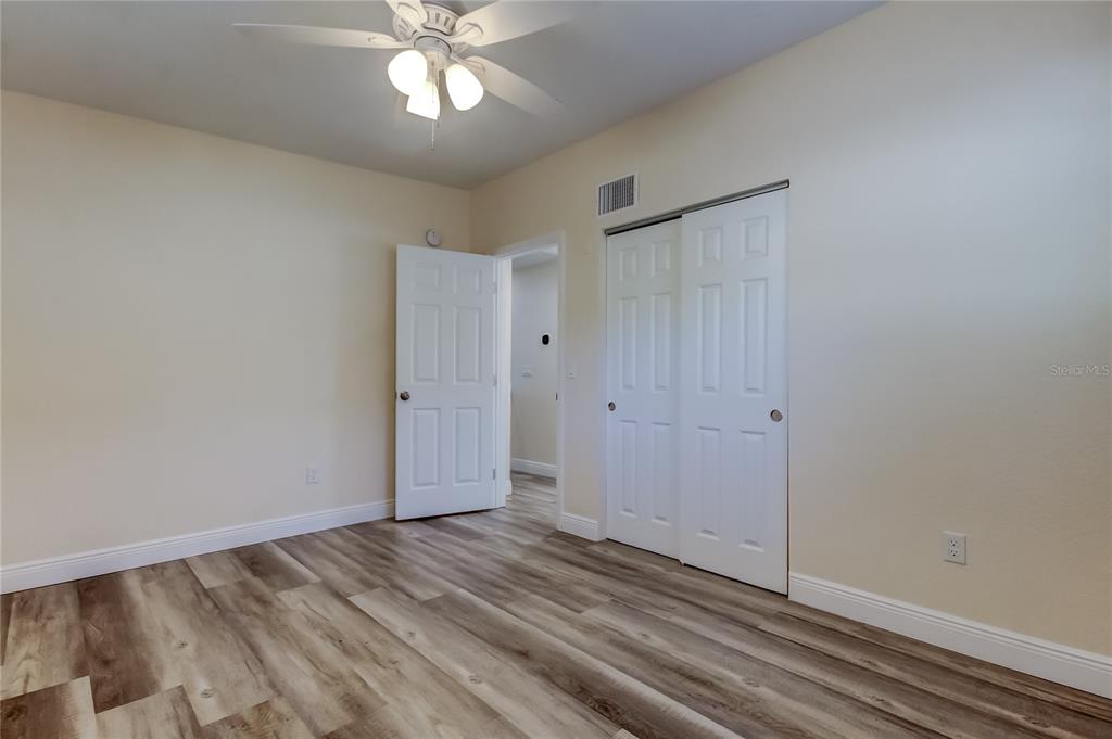 1353 Mary L Road Clearwater, FL 33755 - Photo 31 of 44 a view of a livingroom with a ceiling fan window and wooden floor