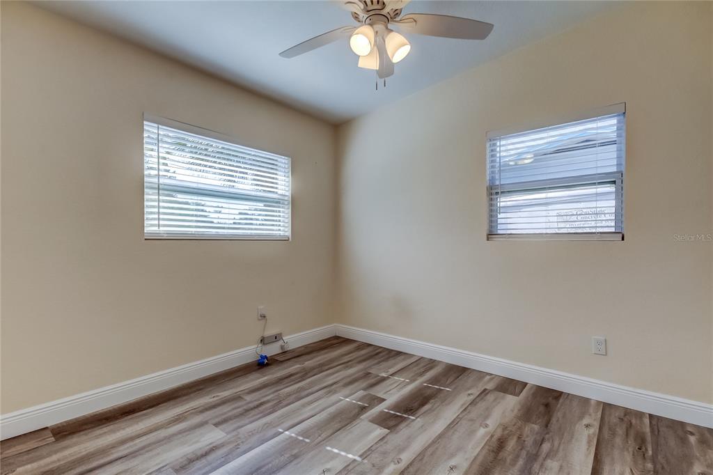 1353 Mary L Road Clearwater, FL 33755 - Photo 33 of 44 a view of empty room with wooden floor