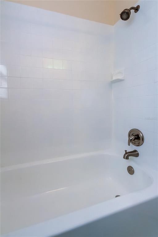 1353 Mary L Road Clearwater, FL 33755 - Photo 39 of 44 a bathroom with a bathtub