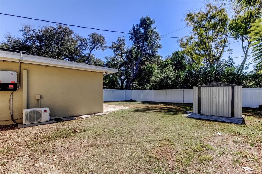 1353 Mary L Road Clearwater, FL 33755 - Photo 43 of 44 a backyard of a house