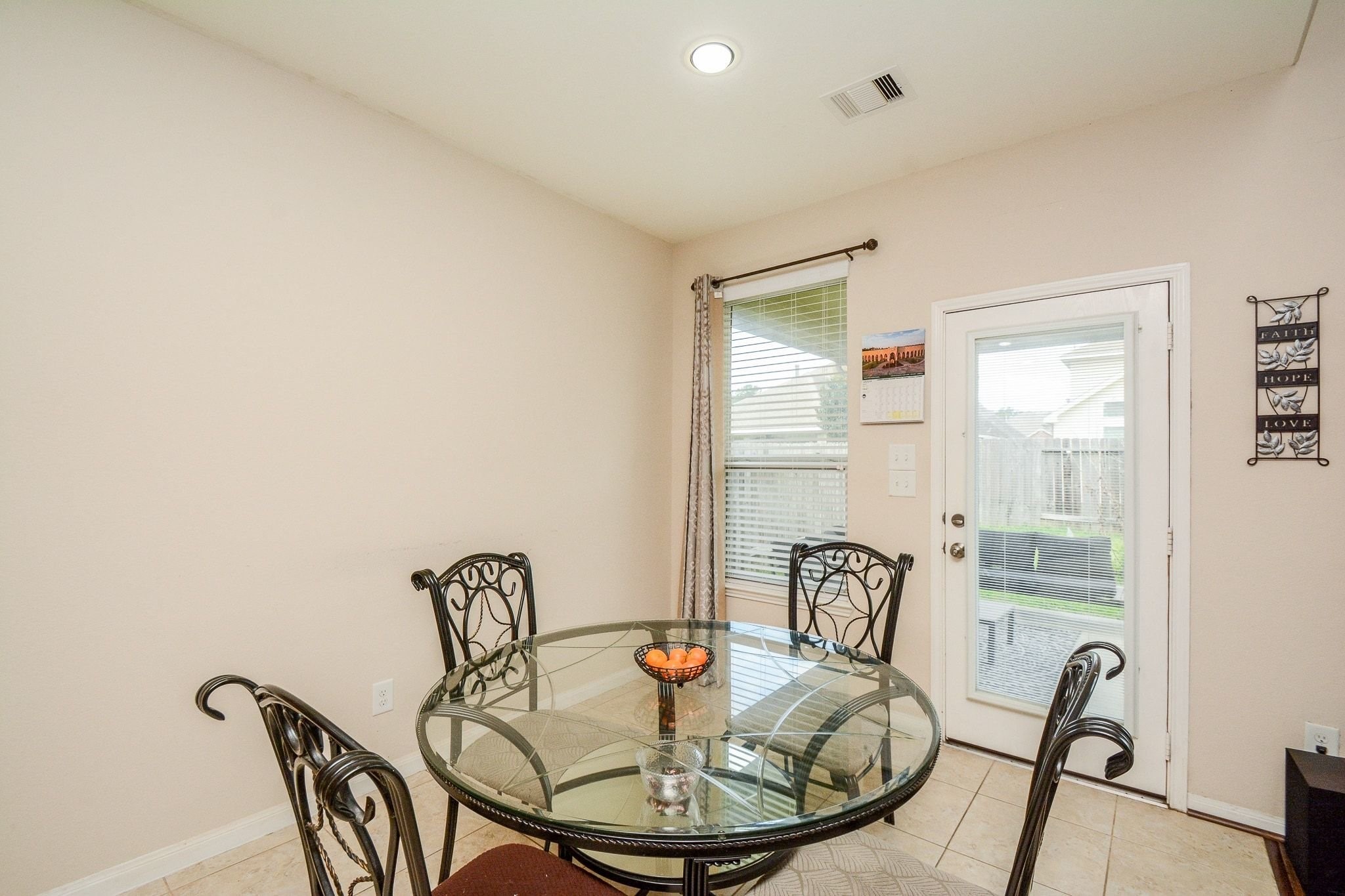 7046 Sliding Rock Circle Spring, TX 77379 - Photo 11 of 41 Enjoy breakfast with serene patio views.