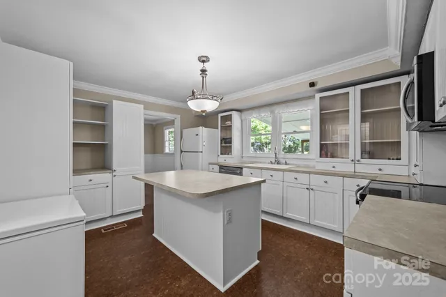 a kitchen with a sink stove and refrigerator