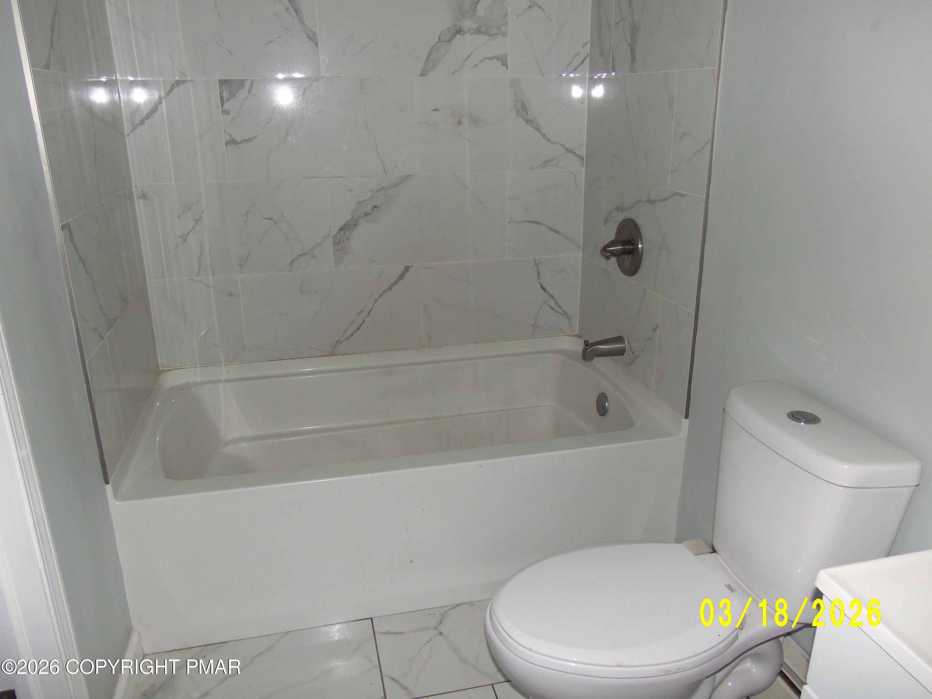 240 Powder Horn Road Henryville, PA 18332 - Photo 14 of 23 a white toilet sitting next to a bath tub