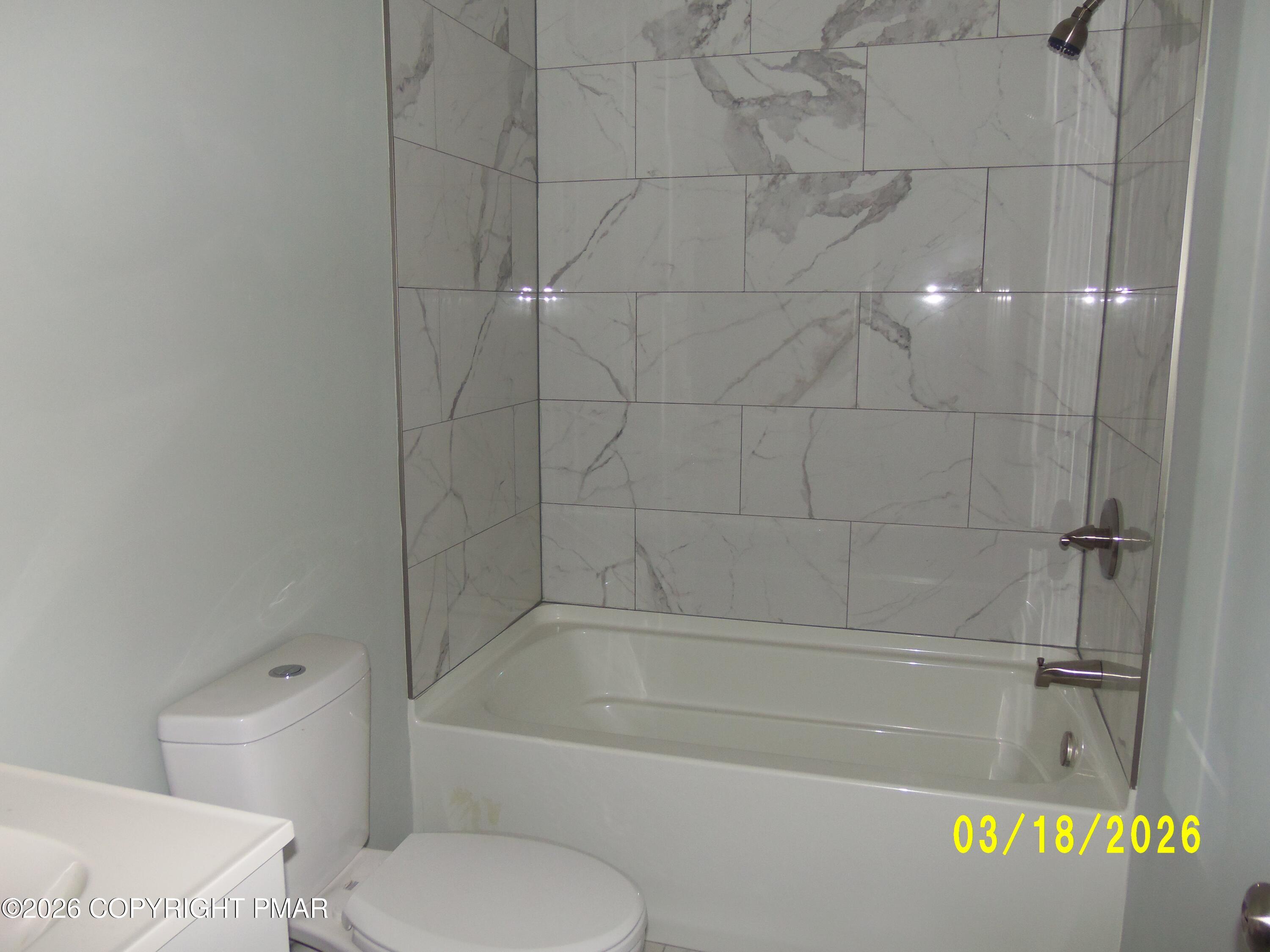 240 Powder Horn Road Henryville, PA 18332 - Photo 16 of 23 a bathroom with a bathtub and a toilet