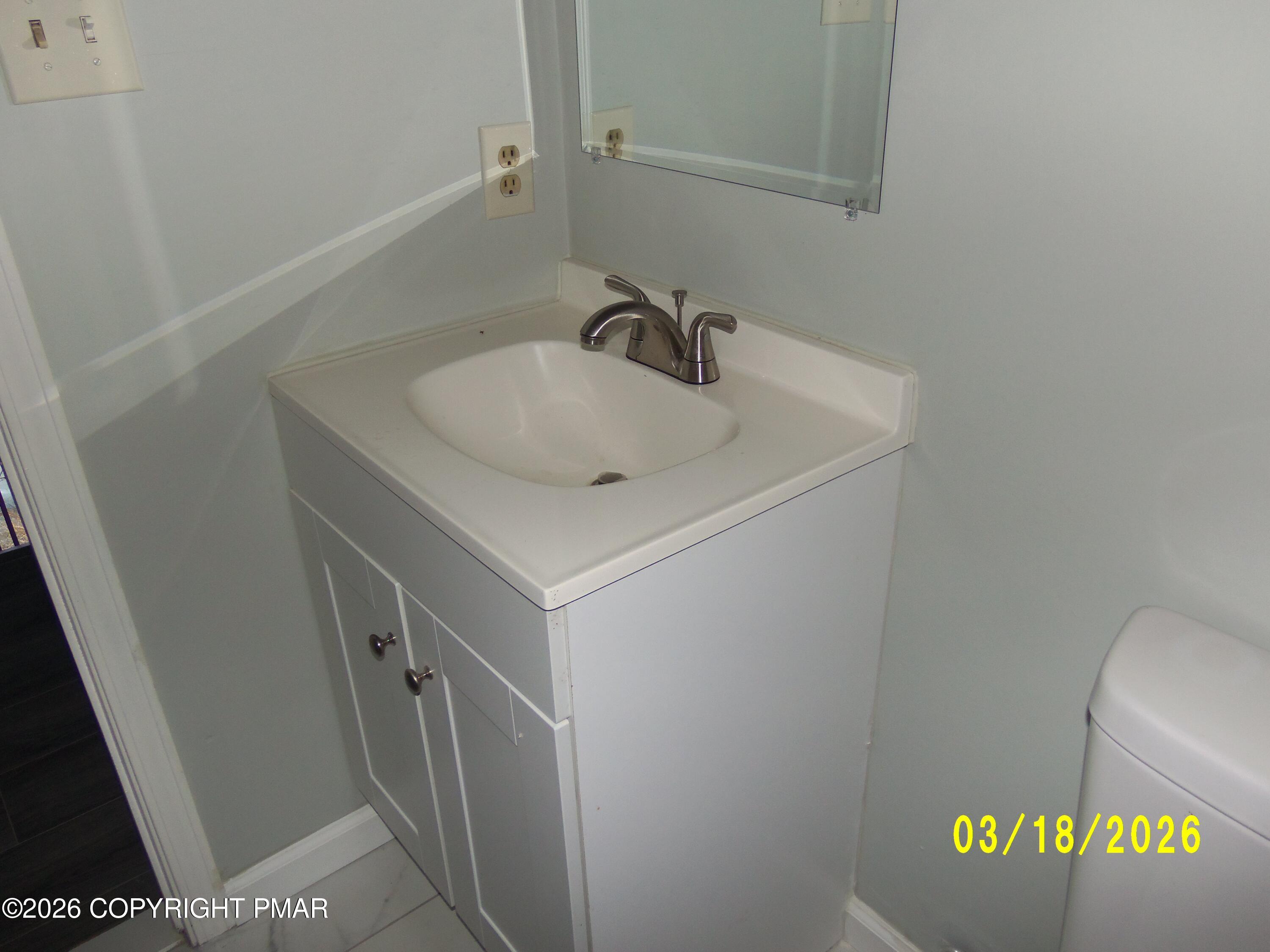 240 Powder Horn Road Henryville, PA 18332 - Photo 17 of 23 a bathroom with a sink and a vanity