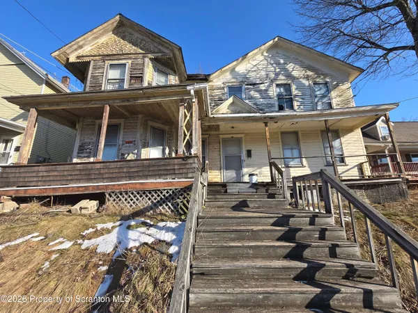 front view of a house with a small yard