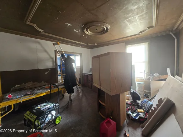 a room with furniture and a flat screen tv