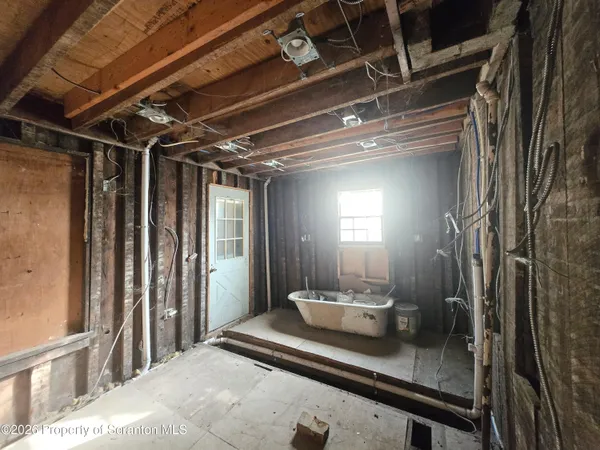 a bed room with a bed and a large window