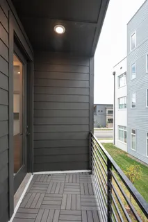 a view of balcony with wooden floor