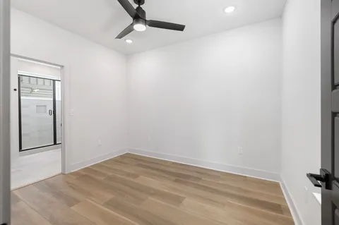 an empty room with a empty space and windows