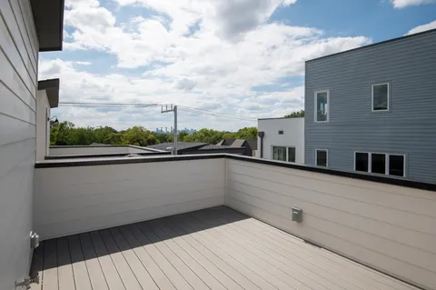 a view of balcony with furniture