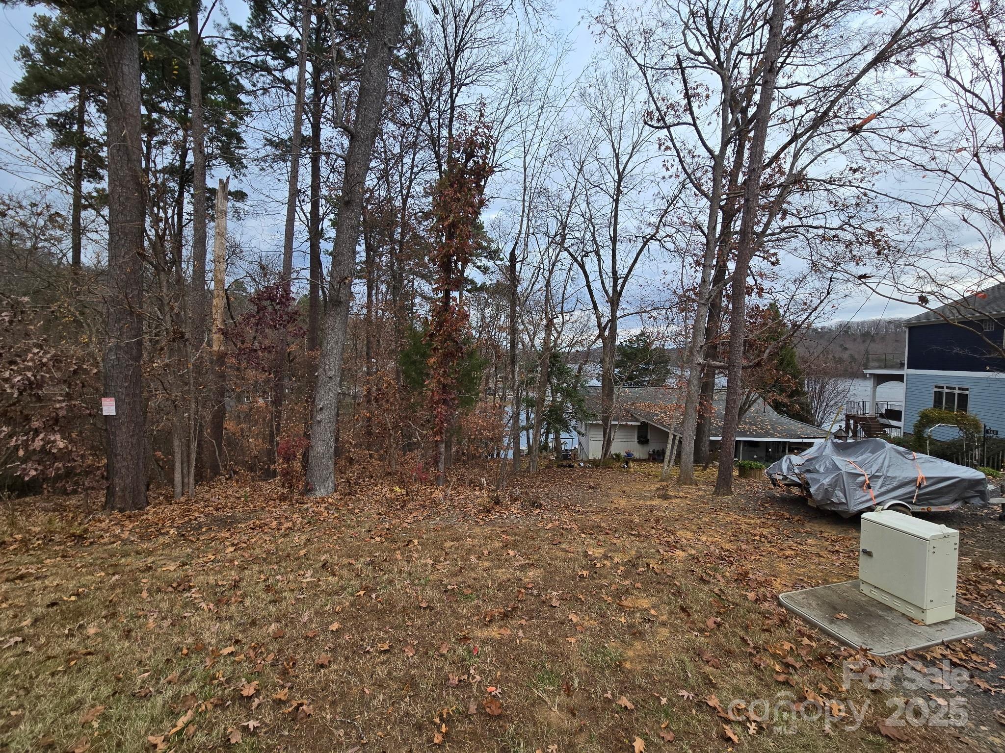 0 Shoreline Road, Unit 107 Badin Lake, NC 28127 - Photo 3 of 48 a backyard of a house with lots of green space