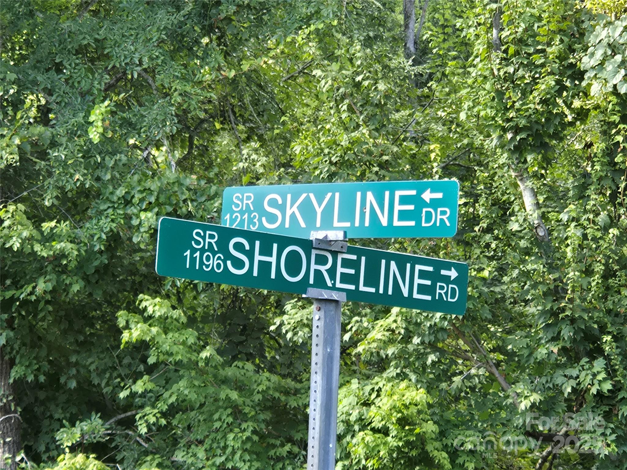0 Shoreline Road, Unit 107 Badin Lake, NC 28127 - Photo 31 of 48 a street sign that is sitting on a pole