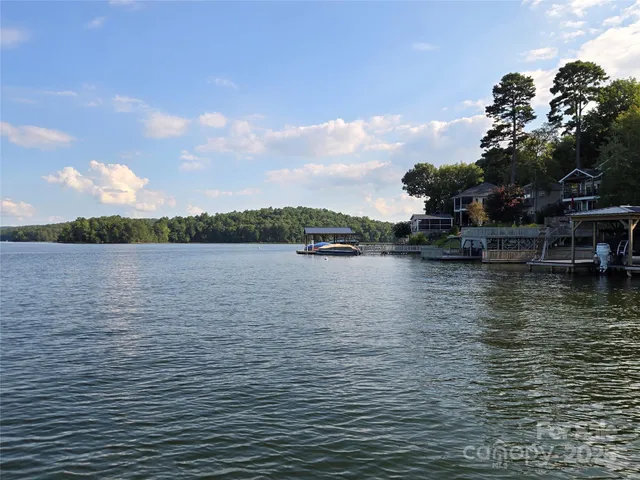 a view of a lake with a house in the background
