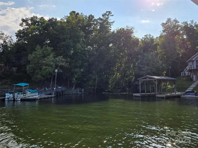 a view of a lake with a house in the background