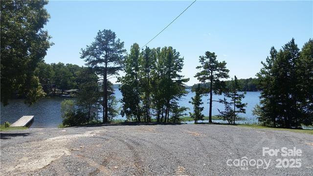 0 Shoreline Road, Unit 107 Badin Lake, NC 28127 - Photo 45 of 48 a backyard of a house with lots of green space