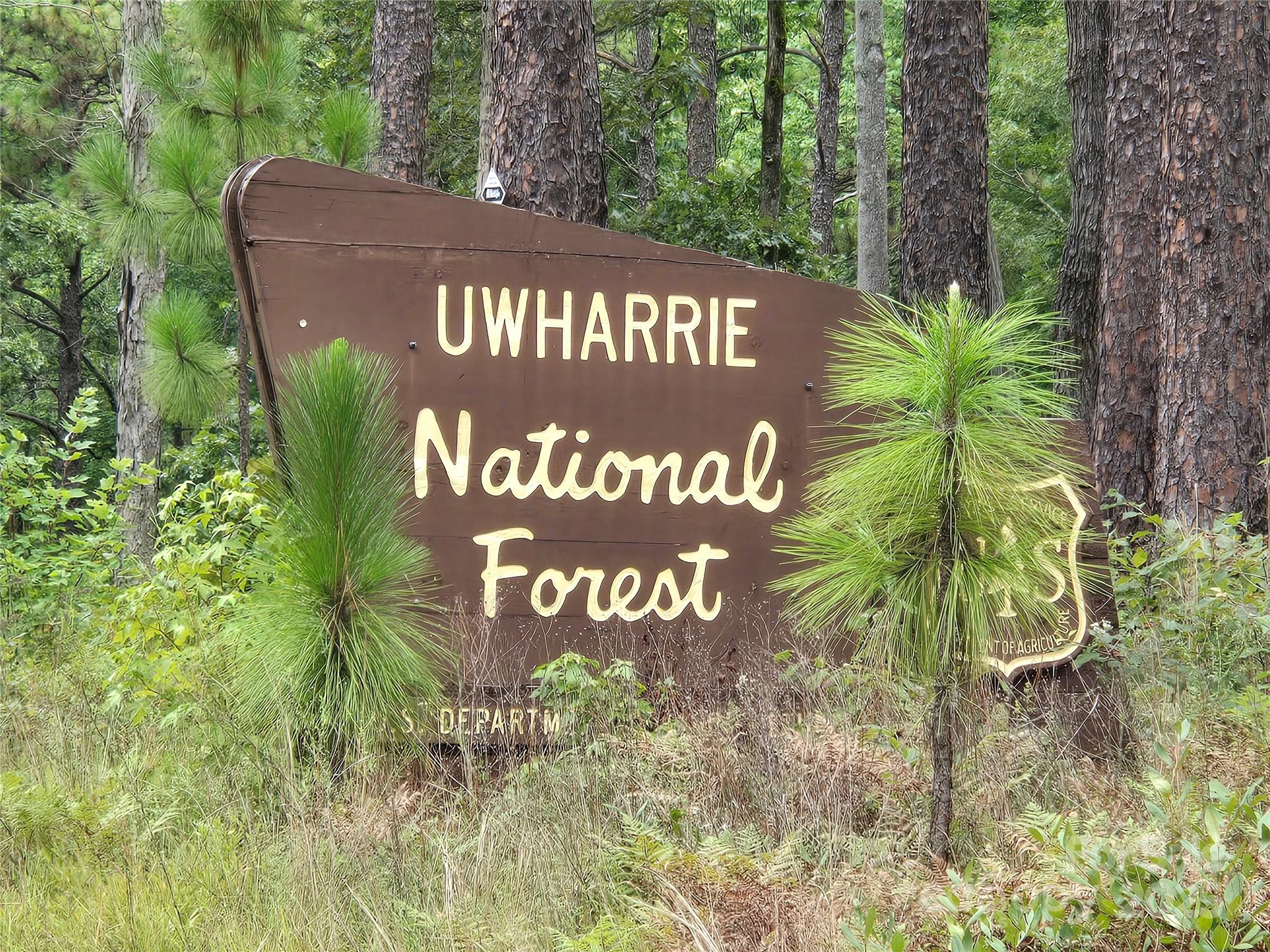 0 Shoreline Road, Unit 107 Badin Lake, NC 28127 - Photo 48 of 48 a view of outdoor space with signage and flags
