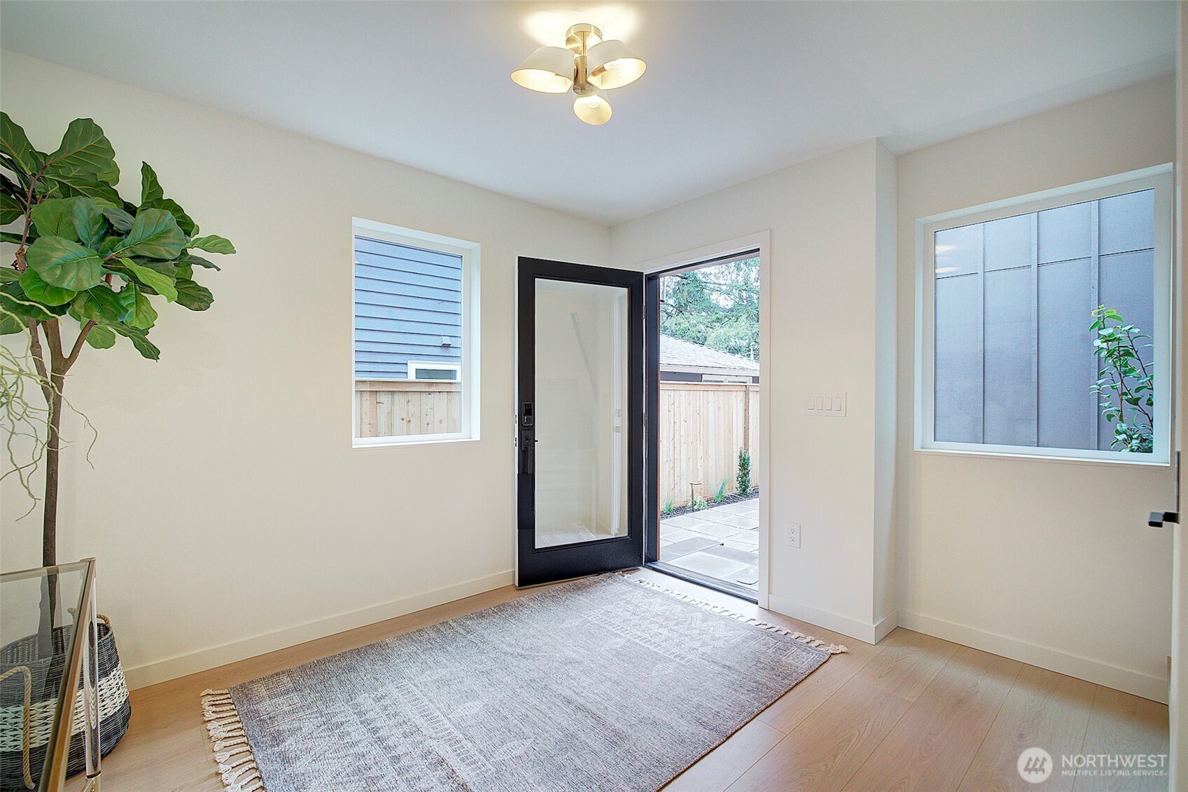 7341 California Avenue Southwest Seattle, WA 98136 - Photo 17 of 40 wooden floor in an empty room with a window