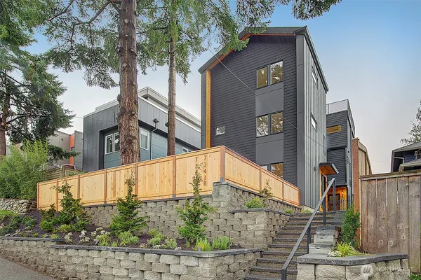 a view of backyard of house and trees