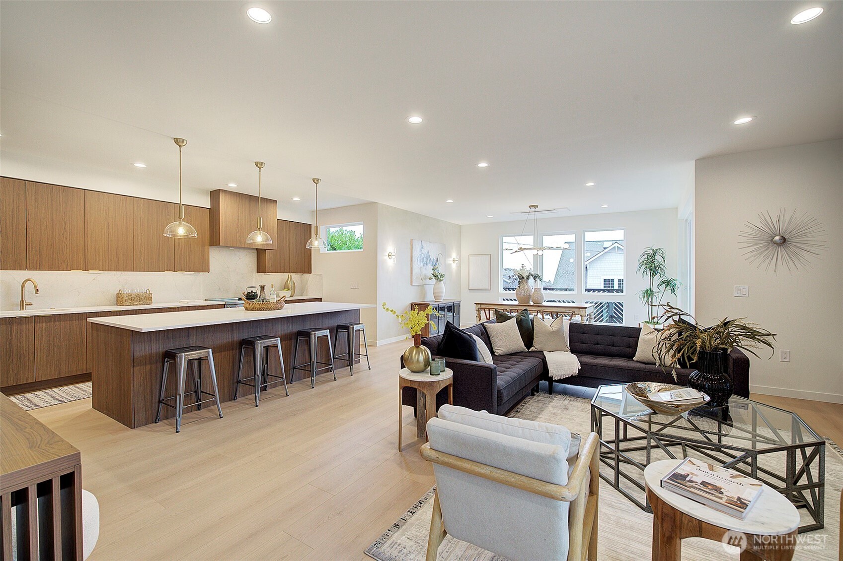 7341 California Avenue Southwest Seattle, WA 98136 - Photo 7 of 40 a living room with furniture a kitchen island a sink and a stove