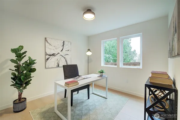 a living room with furniture and kitchen view