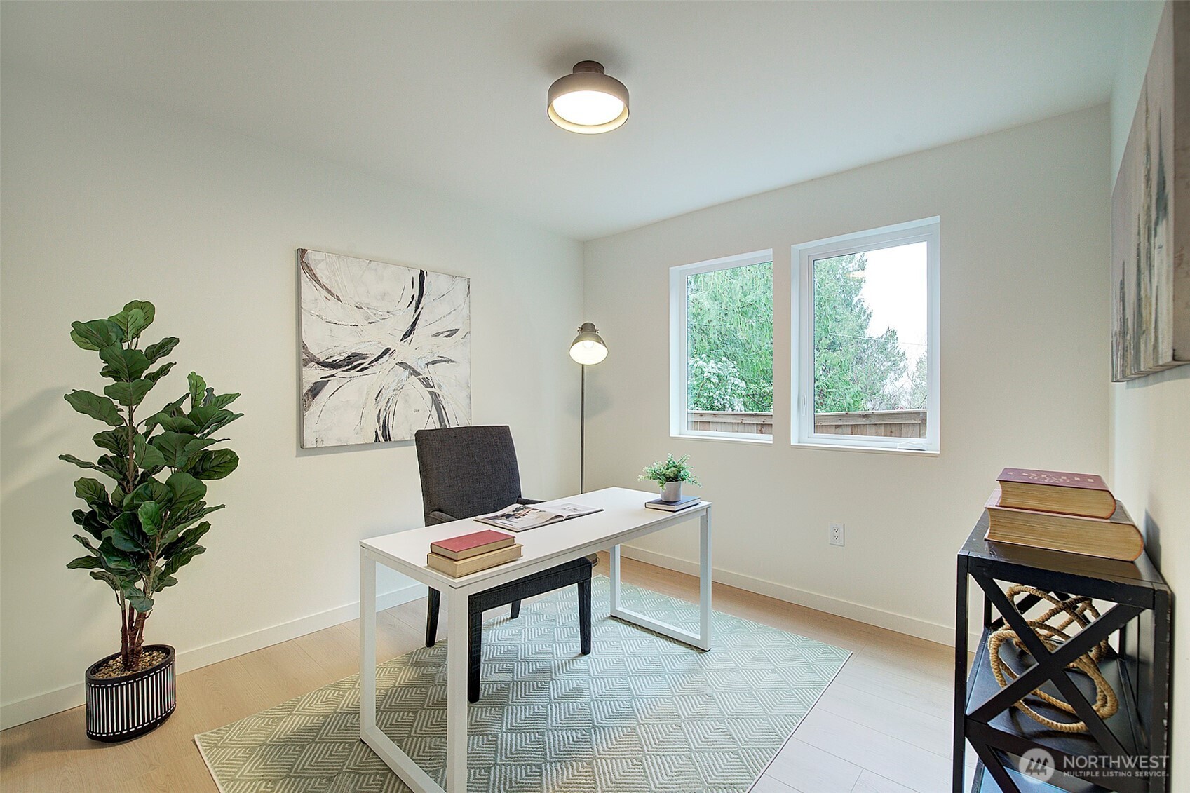 7341 California Avenue Southwest Seattle, WA 98136 - Photo 8 of 40 a workspace with furniture and a potted plant