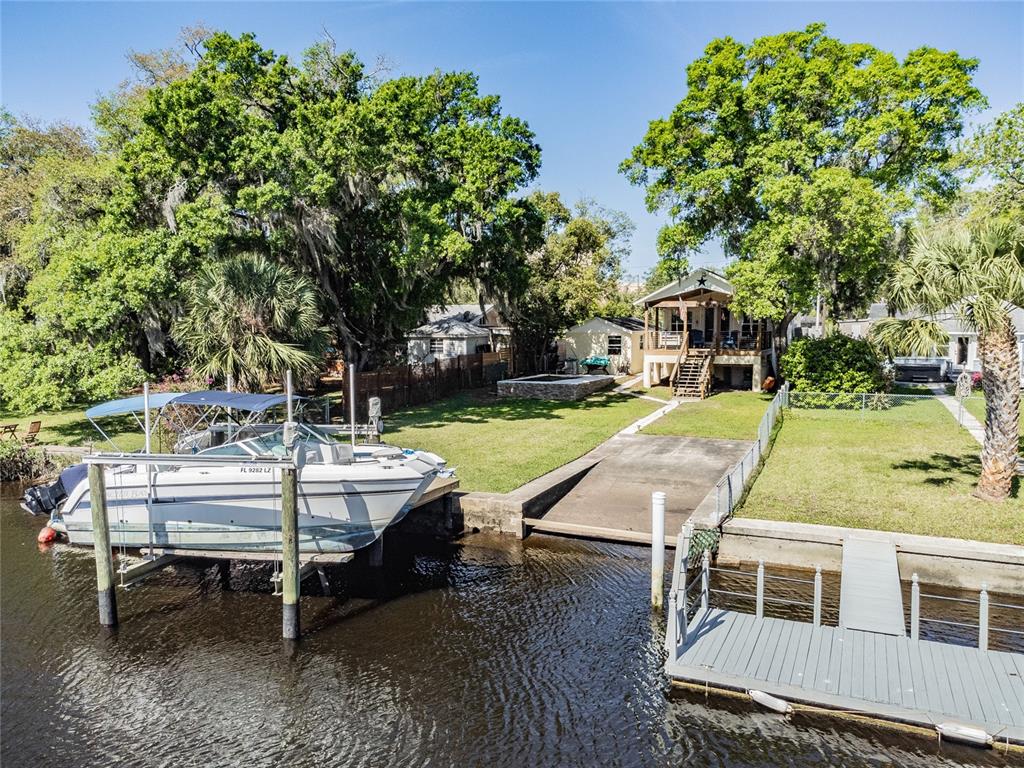 6026 River Road New Port Richey, FL 34652 - Photo 1 of 1 a view of a swimming pool with lounge chair