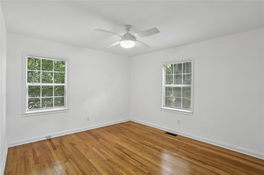 2130 Main Street Northwest Atlanta, GA 30318 - Photo 11 of 17 an empty room with wooden floor and windows