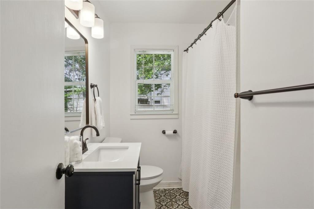 2130 Main Street Northwest Atlanta, GA 30318 - Photo 13 of 17 a bathroom with a sink toilet and a mirror