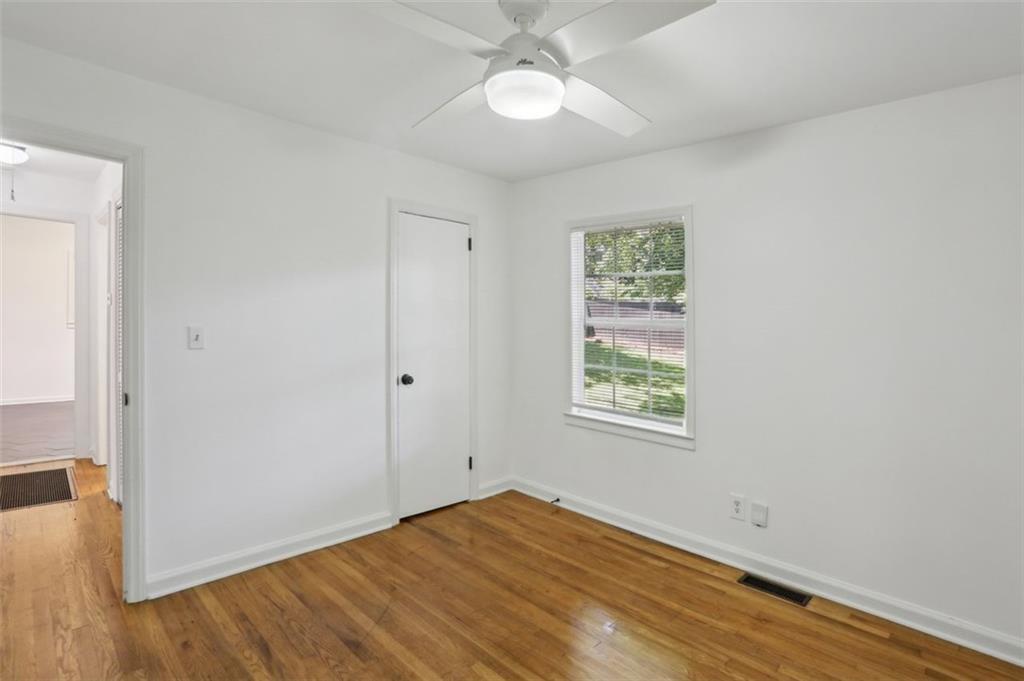 2130 Main Street Northwest Atlanta, GA 30318 - Photo 15 of 17 an empty room with wooden floor closet and windows